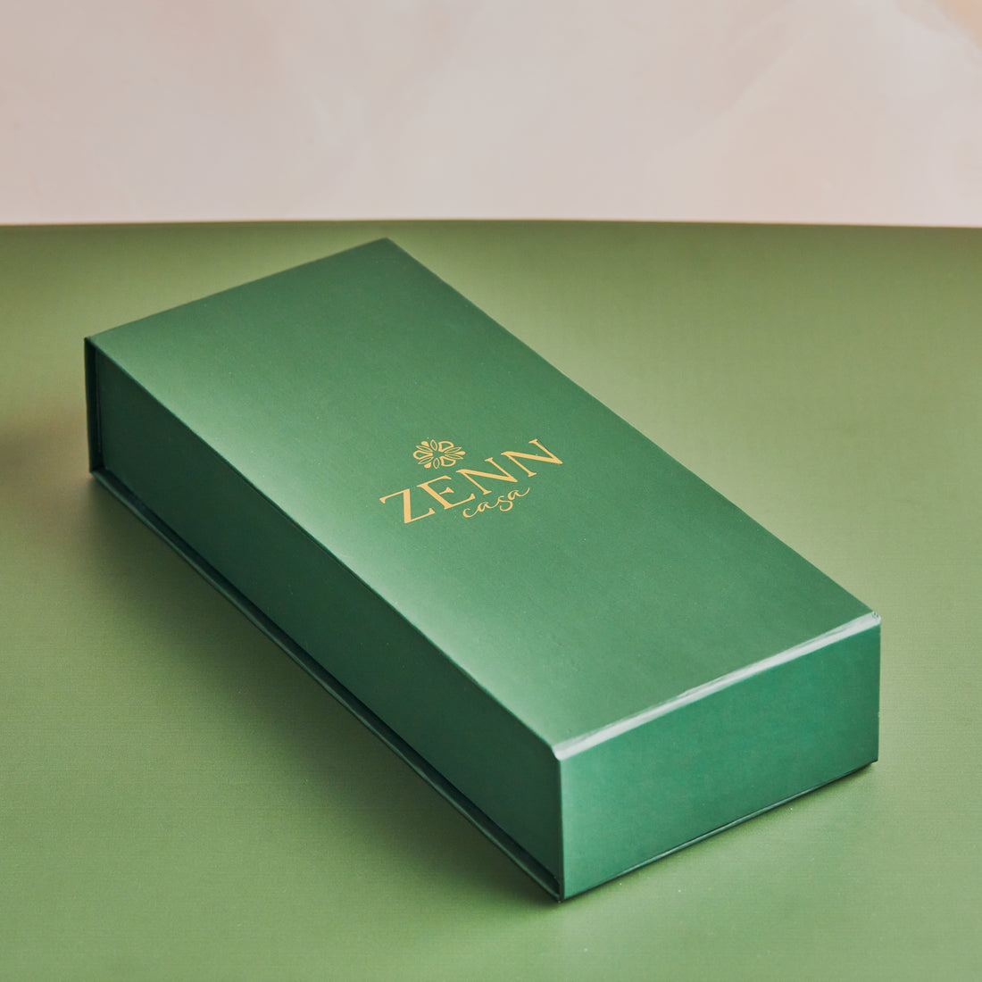 Green rectangular box labeled “ZENN” in gold lettering